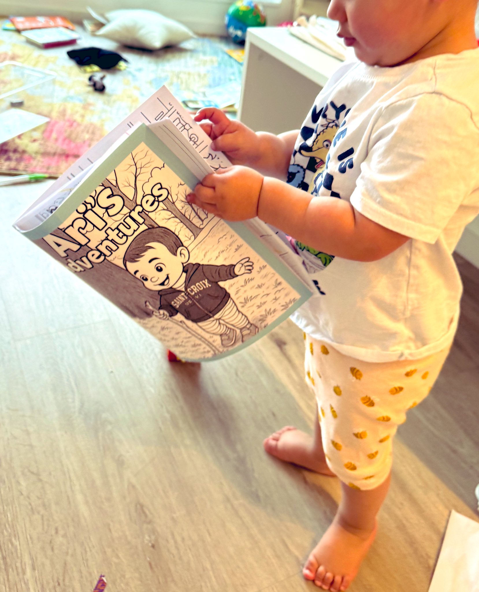 Happy kid holding a coloring book